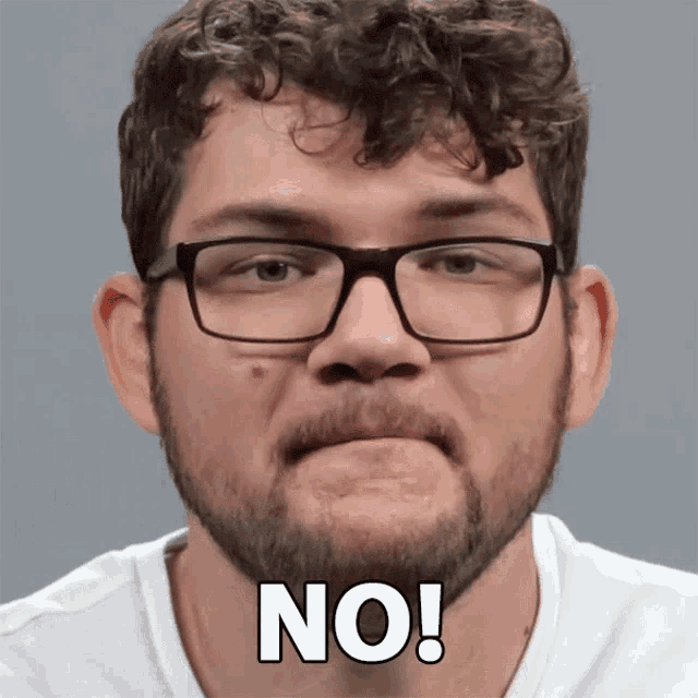 a man with glasses and a beard has the word no on his face