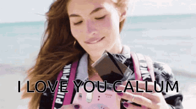 a woman taking a picture with the words " i love you callum " written on the bottom
