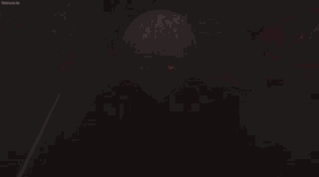 a person with red eyes is holding a sword in their hand