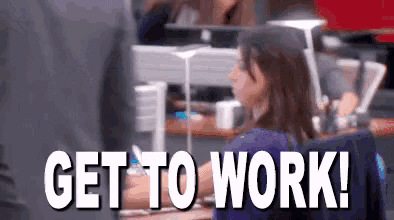 a woman is sitting at a desk in front of a computer with the words `` get to work '' .