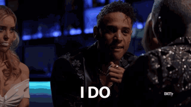 a man says " i do " while talking to a woman