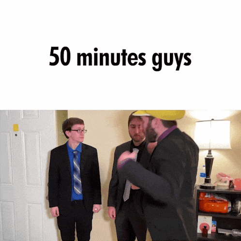 three men in suits and ties are standing in front of a door with the words 50 minutes guys written above them