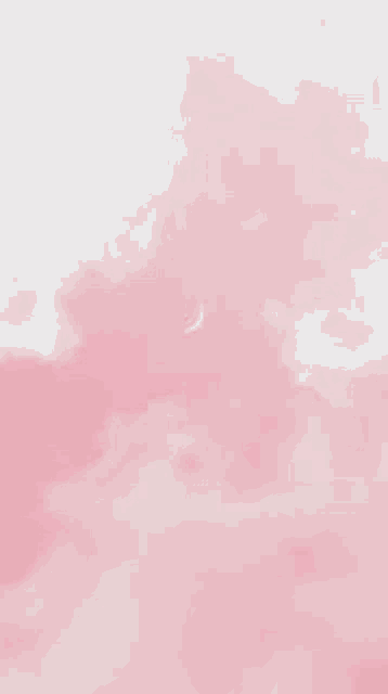 a crescent moon is floating in the pink clouds .