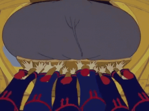 a group of people are reaching out towards a large elephant 's butt