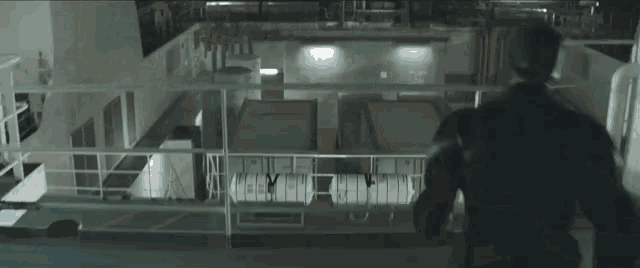 a man is flying through the air in a dark room