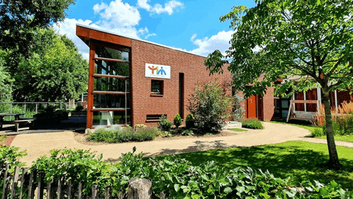 a brick building with a sign on it that says yin