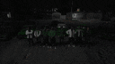 a blurred image of a green background with the words `` familia '' written in white letters .