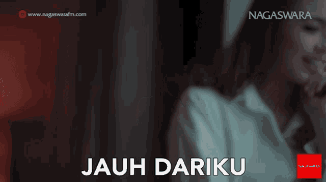 a woman is talking on a cell phone and the words jauh dariku are visible