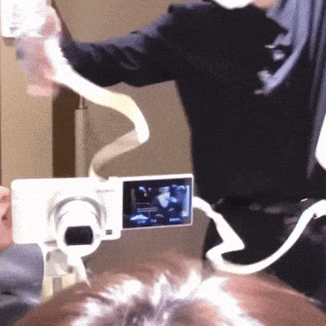 a person is taking a picture with a camera that is attached to their head