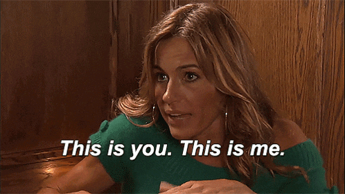 a woman in a green sweater is saying this is you this is me
