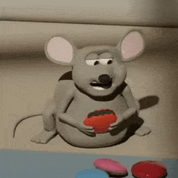 a cartoon mouse is eating a heart shaped cookie