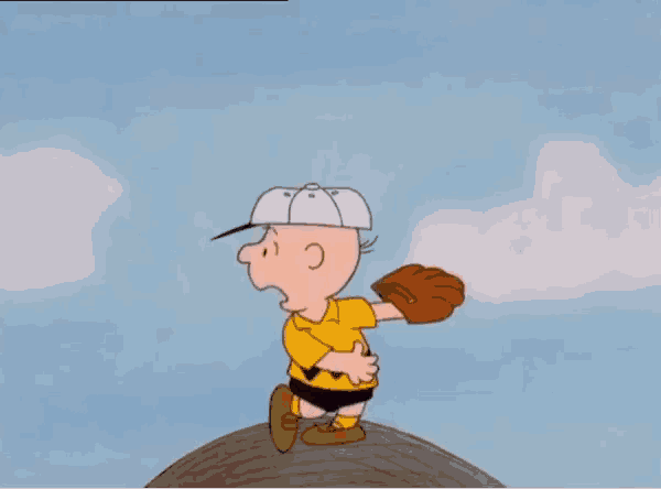 charlie brown is doing a handstand in the air with his feet in the air .