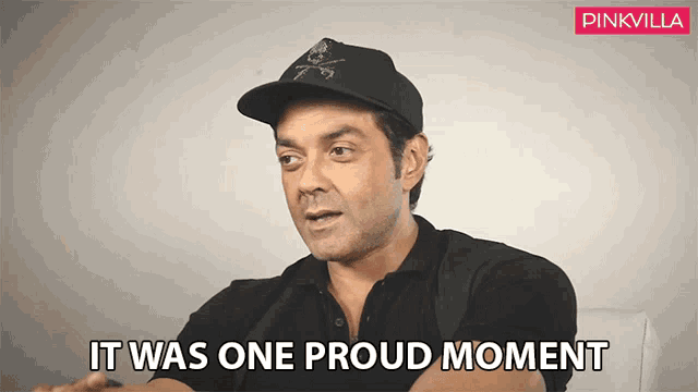 a man wearing a black shirt and a black hat says it was one proud moment