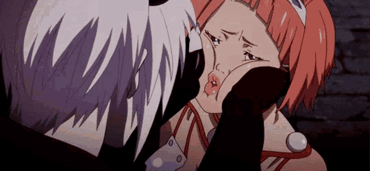 a girl with pink hair is being kissed by a man