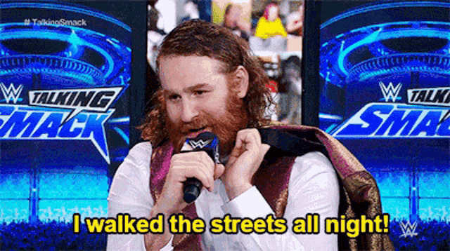 a man talking into a microphone with the words i walked the streets all night