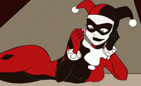 a cartoon drawing of harley quinn laying down with a purple object in her hand