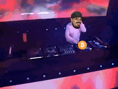 a man in a pink shirt is playing a record with a bitcoin icon on it