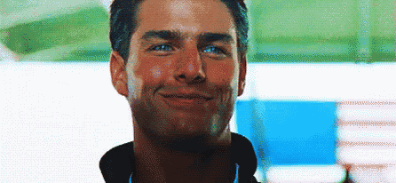 a close up of a man 's face with a smile .