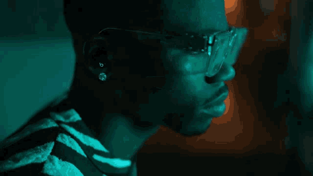 a close up of a man 's face wearing sunglasses