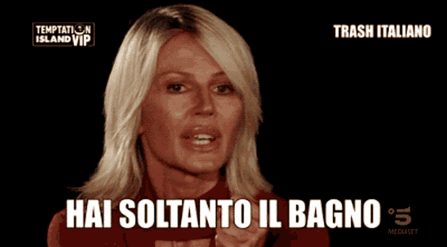 a woman says hai soltanto il bagno while pointing at the camera