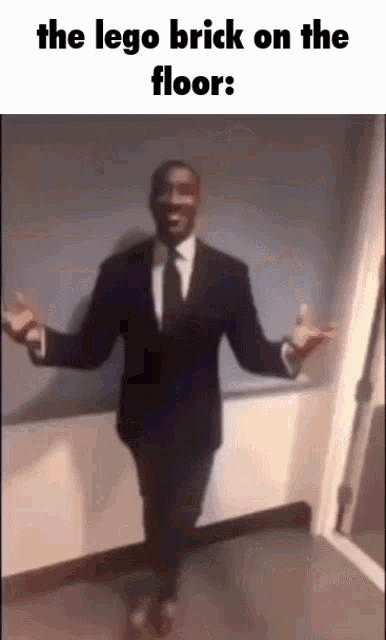 Lego Brick On The Floor Guy In Suit GIF - Lego Brick On The Floor Guy In Suit Guy In Suit Slideshow GIFs