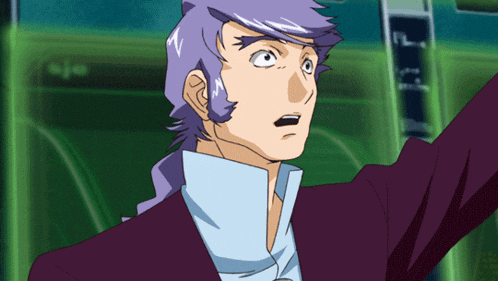 a man with purple hair and a blue shirt is standing in front of a green wall