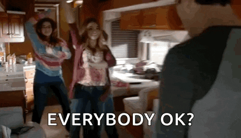 a group of people are dancing in a kitchen while a man says everybody ok