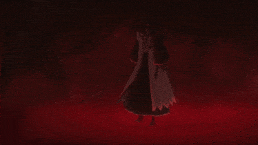 a silhouette of a man holding a sword in a dark room