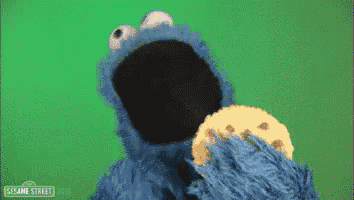 cookie monster from sesame street eating a cookie