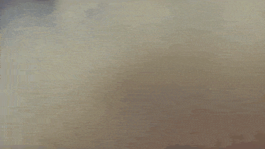 a close up of a person 's face in a foggy room .