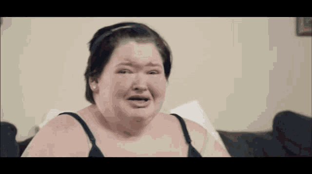 a woman is crying in front of a loading bar that says cockroach