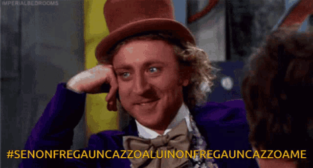 a man wearing a top hat and a bow tie says #senonfregauncazzoaluinoneregauncazzoame