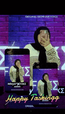 a woman taking a selfie in front of a brick wall that says happy taskingg