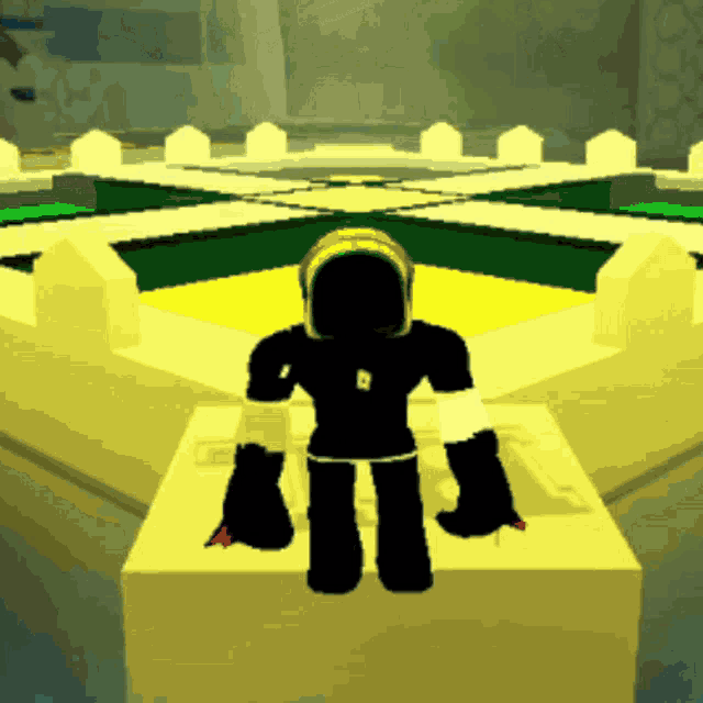 a silhouette of a person wearing a helmet and gloves standing on a block