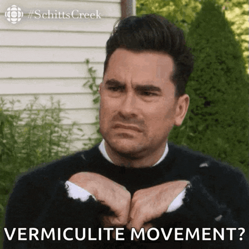 a man in a black sweater is making a face and says vermiculate movement ?