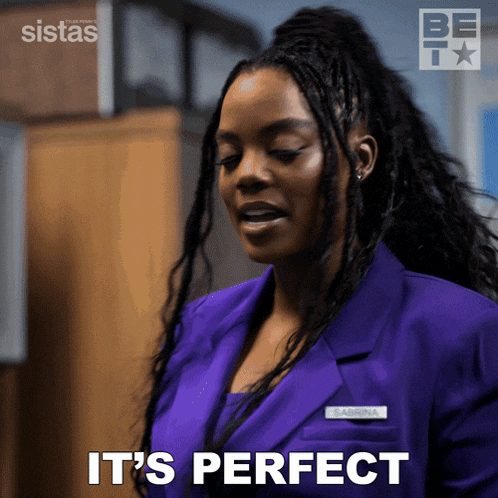 a woman in a purple suit is saying it 's perfect