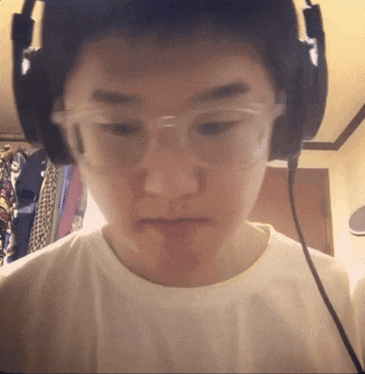 a young man wearing glasses and headphones is looking at the camera