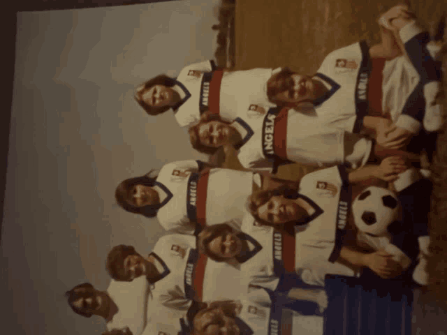 a group of people wearing jerseys that say angels