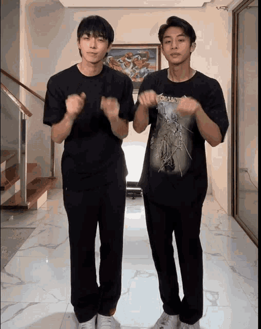 two young men are standing next to each other and one has a shirt that says smash on it