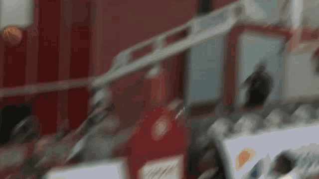 a blurred image of a coca cola bottle being opened