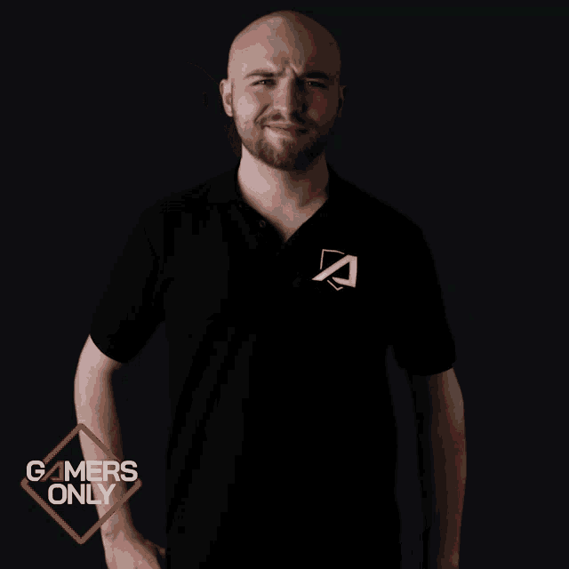 a man in a black shirt with the letter a on it