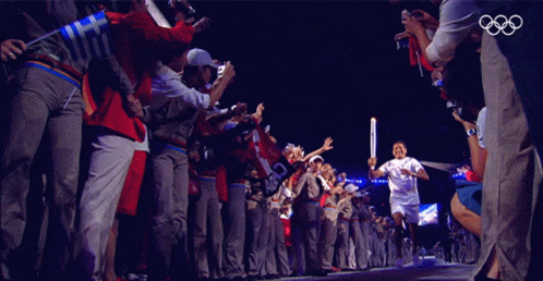 Olympic Fire Olympic Torch Relay GIF - Olympic Fire Olympic Torch Relay Runner GIFs