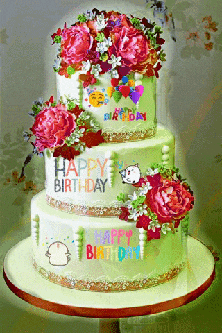 a three tiered birthday cake with flowers and the words happy birthday