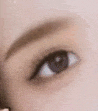 a close up of a woman 's eye with eyeliner