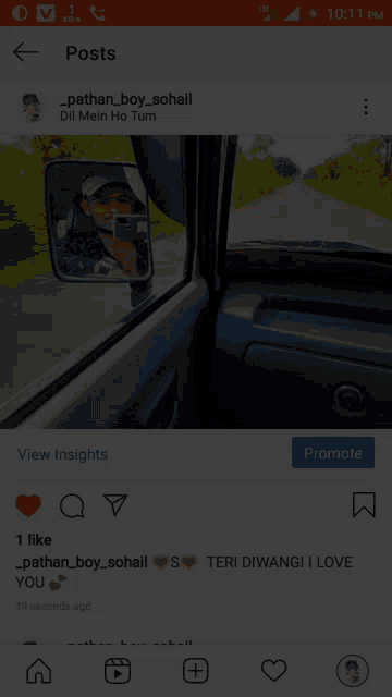 a phone screen shows a picture of a man taking a picture of himself in a car