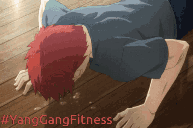 a man with red hair is doing push ups and the hashtag #yanggangfitness is above him