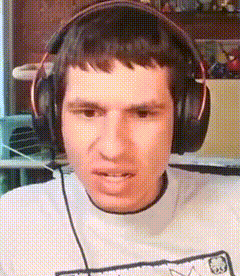 a man is wearing headphones and making a face