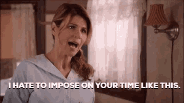 a woman is standing in a room with her mouth open and screaming .