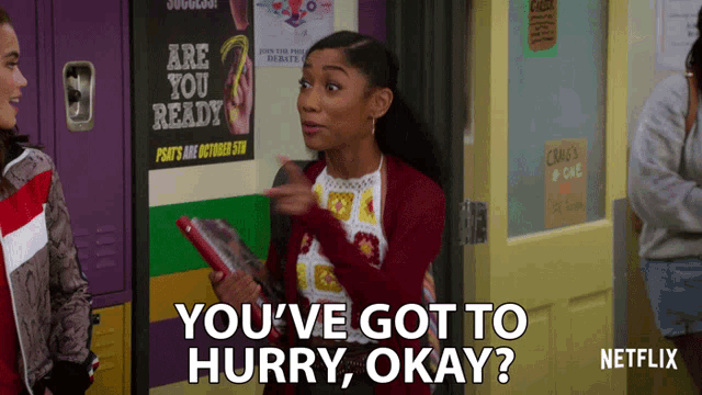 a girl standing in front of a sign that says " are you ready "