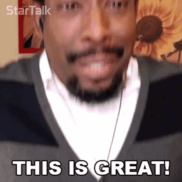 a man with a beard wearing headphones says this is great